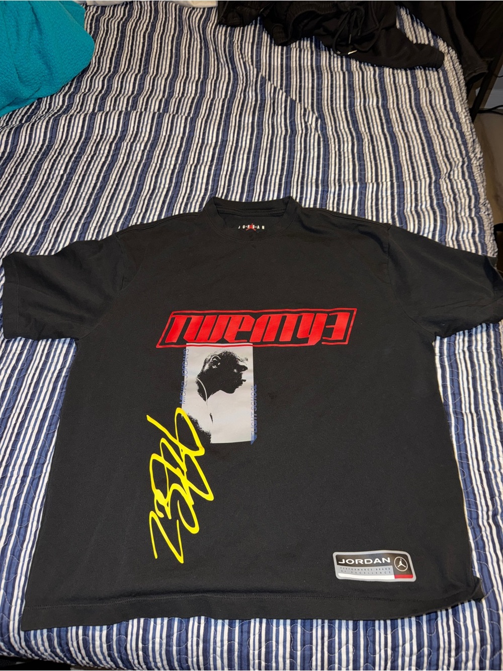 Jordan Black Graphic Short Sleeve Tee with Red & Yellow Accents